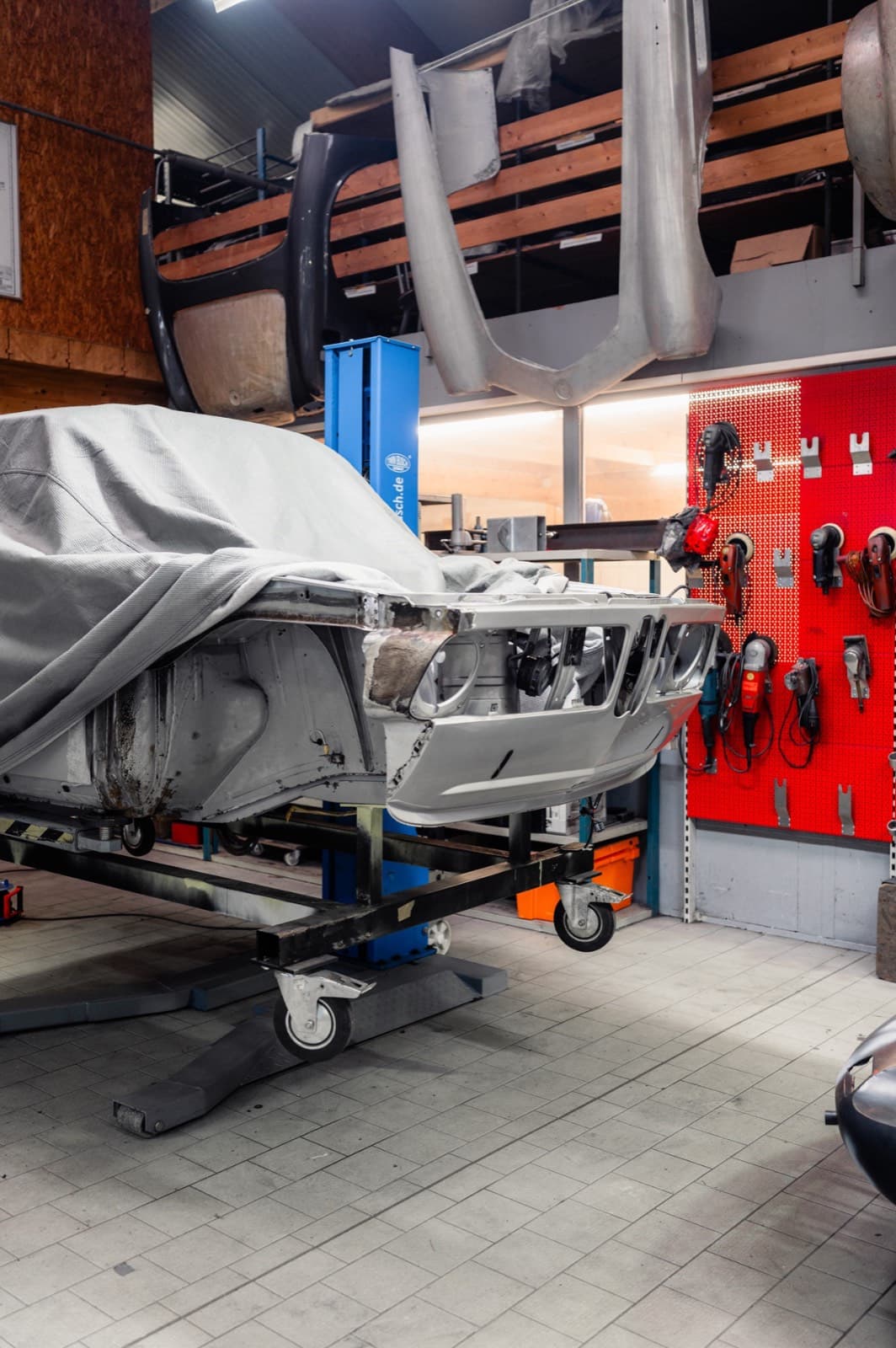 Bavarian Econs workshop with BMW chassis on assembly stand