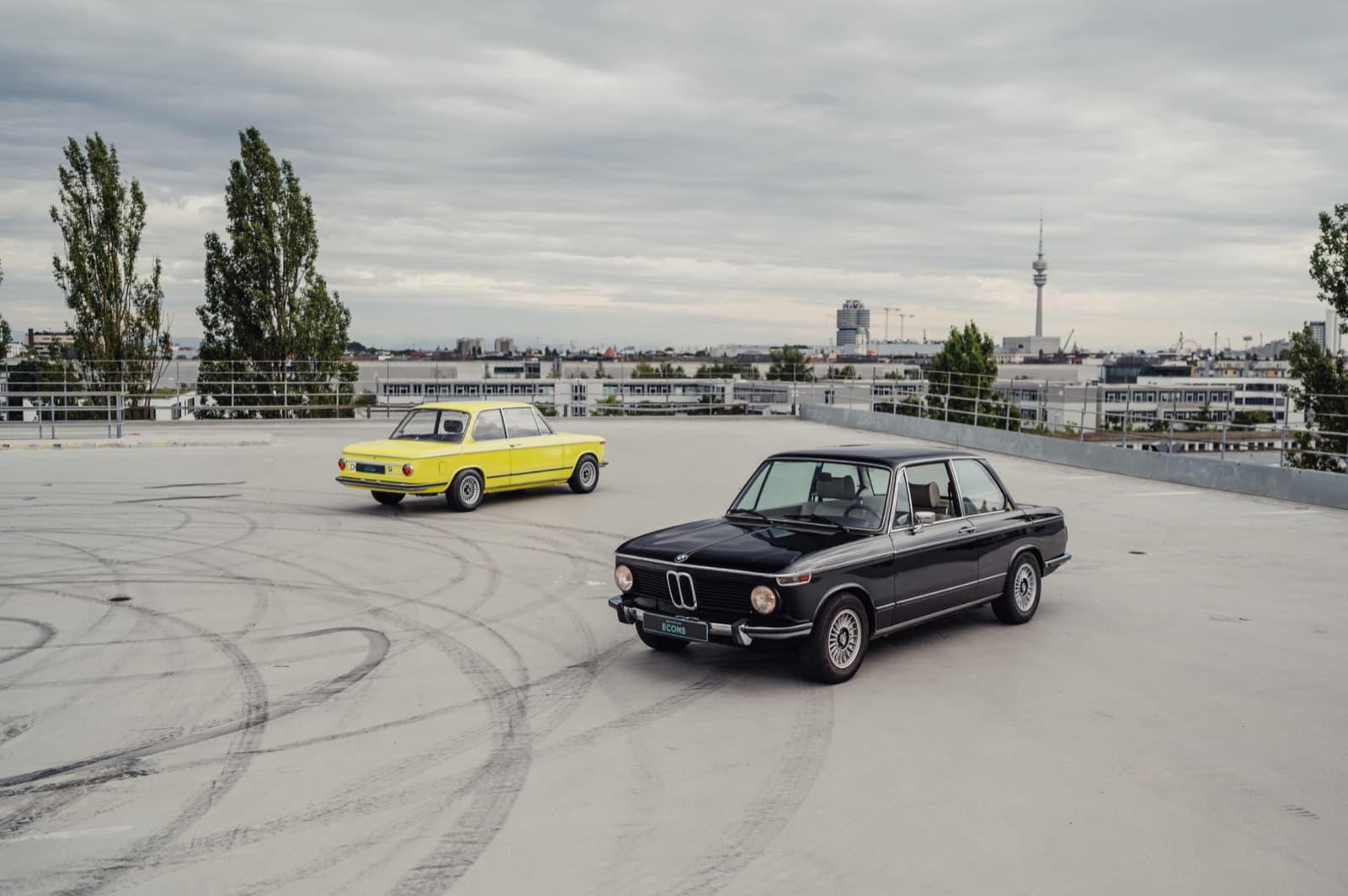 BMW 2002te Yellow and Black on Munich rooftop