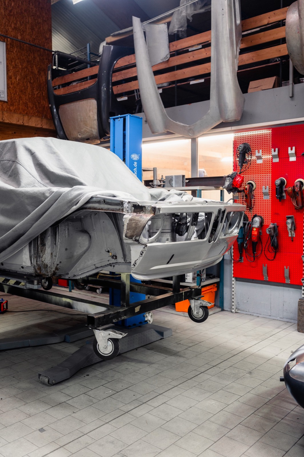 Bavarian Econs workshop with BMW chassis on assembly stand