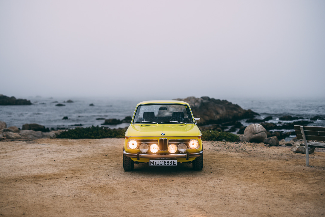 Yellow BMW 2002te electric conversion on California coast